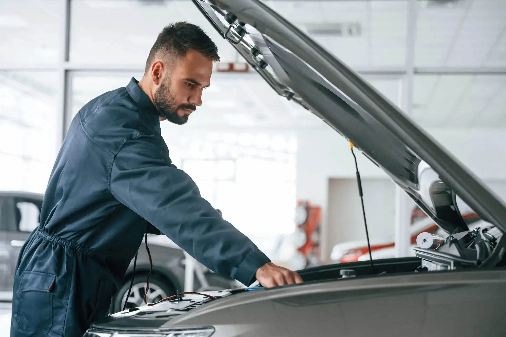 hood-of-vehicle-is-opened-car-repairman-is-in-the-2025-03-18-21-17-17-utc-scaled